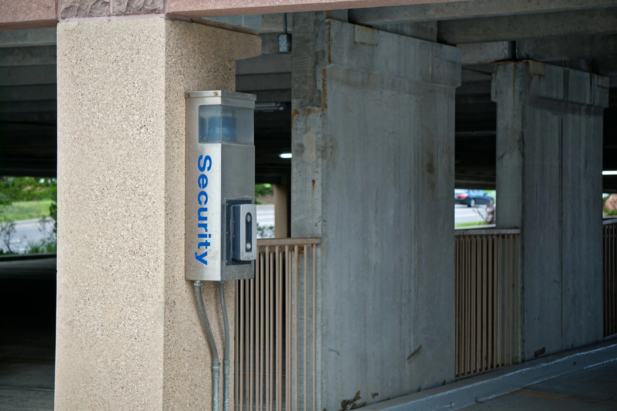 secure dog boarding facilities The Woodlands - A security device mounted in a parking garage enhances safety and connectivity.