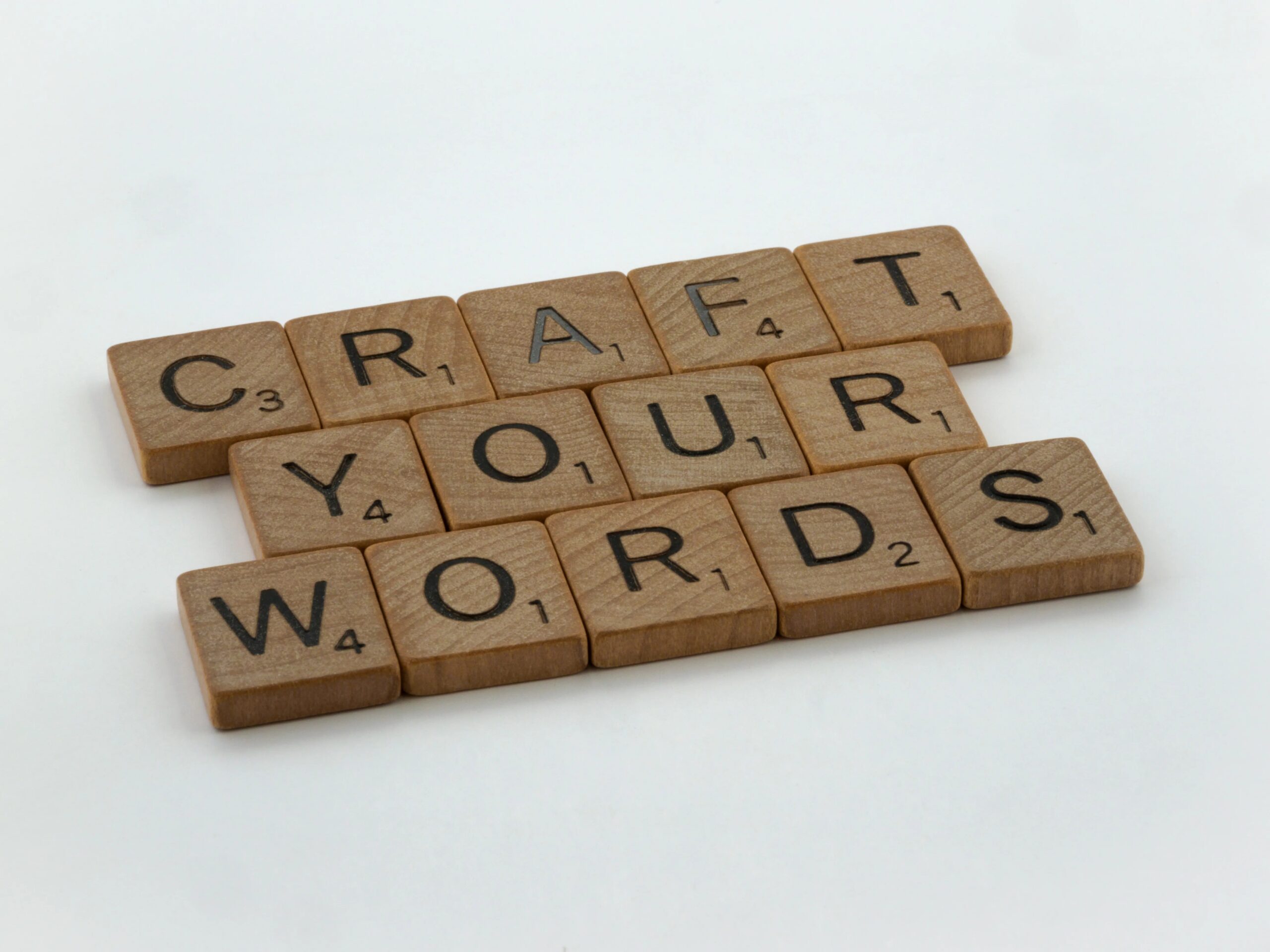 preparing your dog for their first daycare visit - Creative arrangement of word tiles spelling 'Craft Your Words' on a white background.