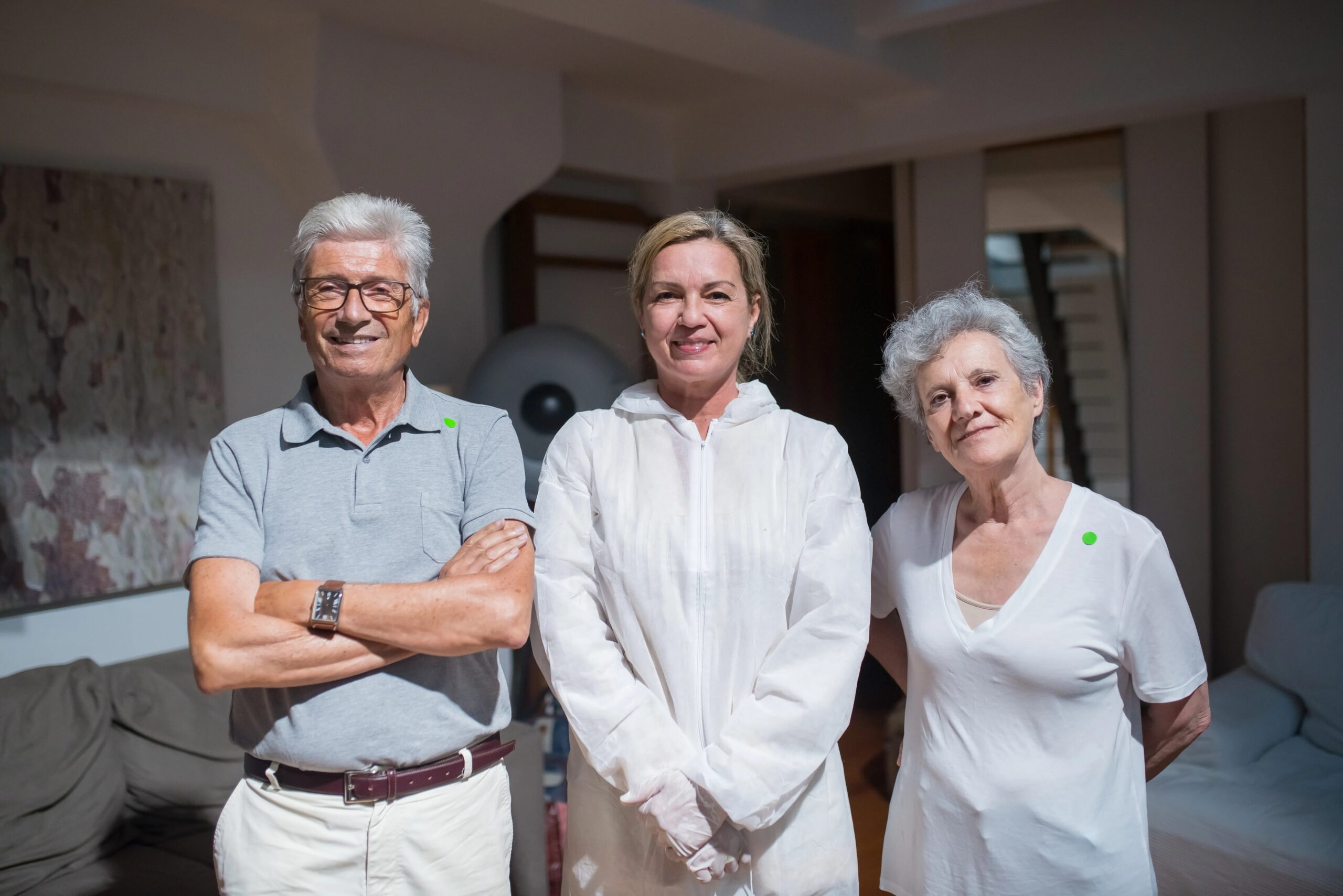 dog grooming tips for busy owners - Group portrait of caregivers with senior adults in a home setting.